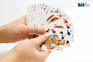 playing cards on hand