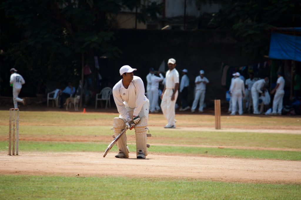 batsman playing cricket in the ground