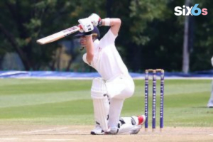 player with a bat and wickets placed behind him playing short in World Cup 2023