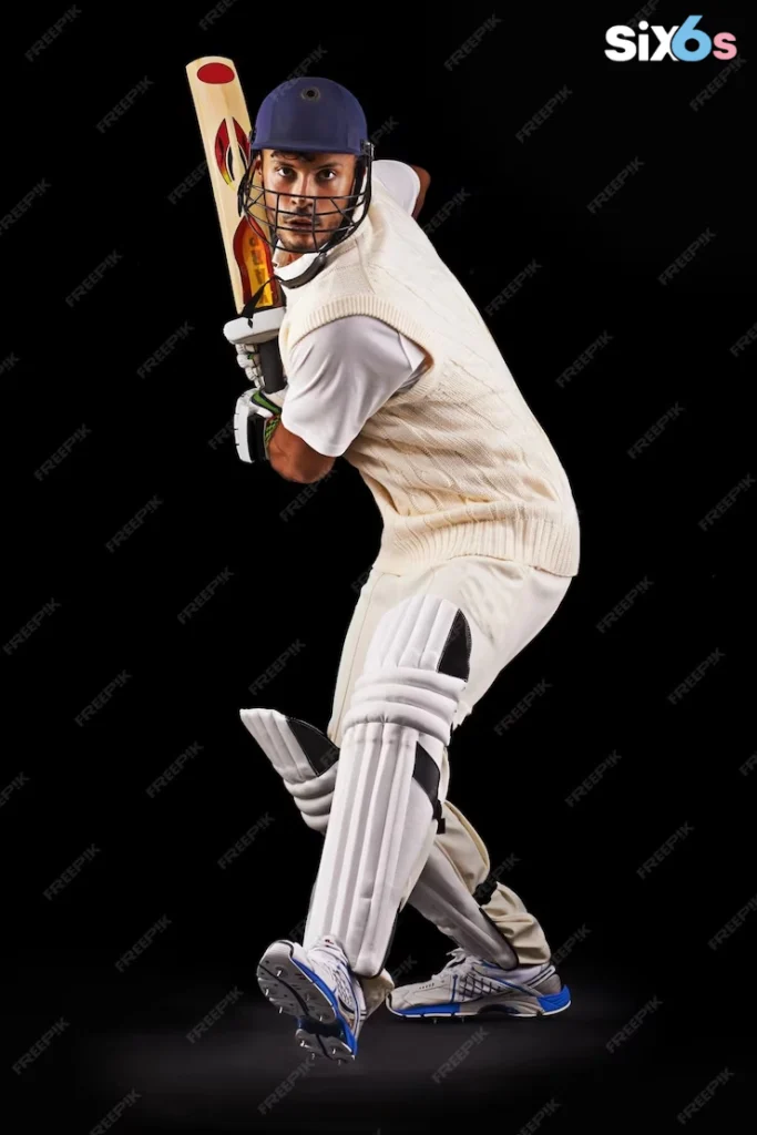 The image features a man dressed in a white cricket uniform, standing in a batting stance and holding a bat to create batsman rankings in Odi